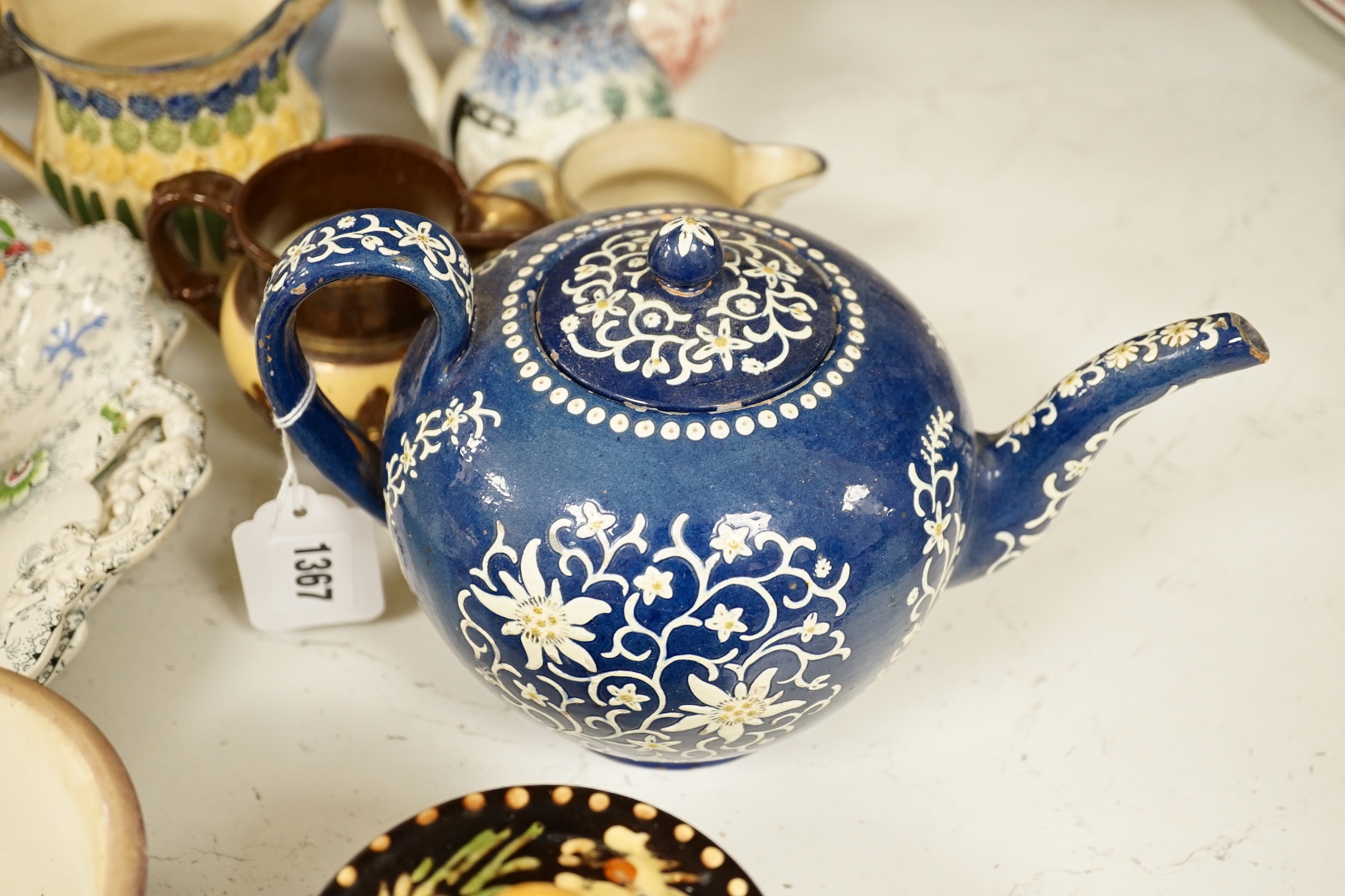 Two Pratt type jugs, an Enoch Wood flower pot, various 19th century pottery jugs, plates etc.